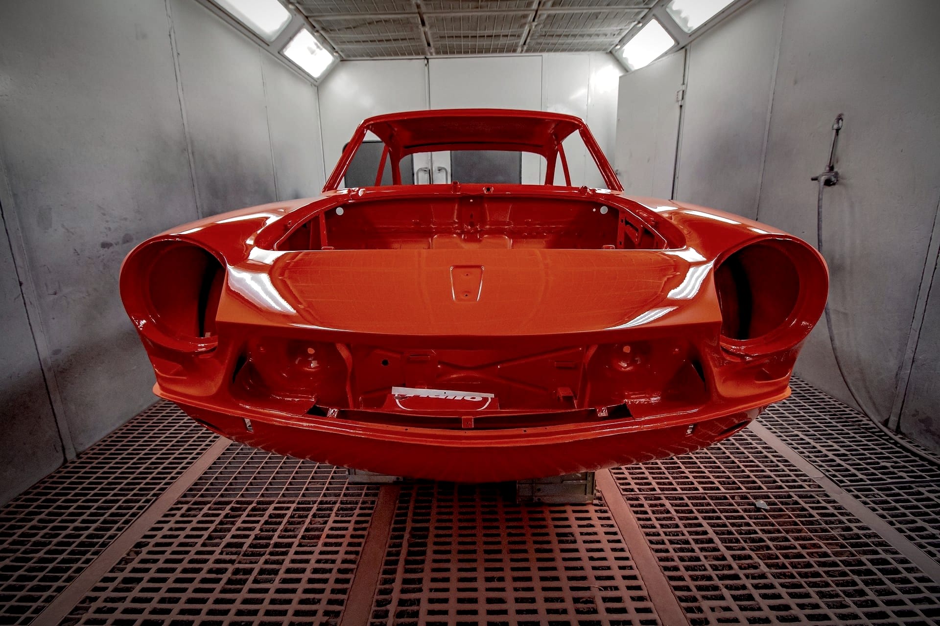 Car body in a professional spray paint booth